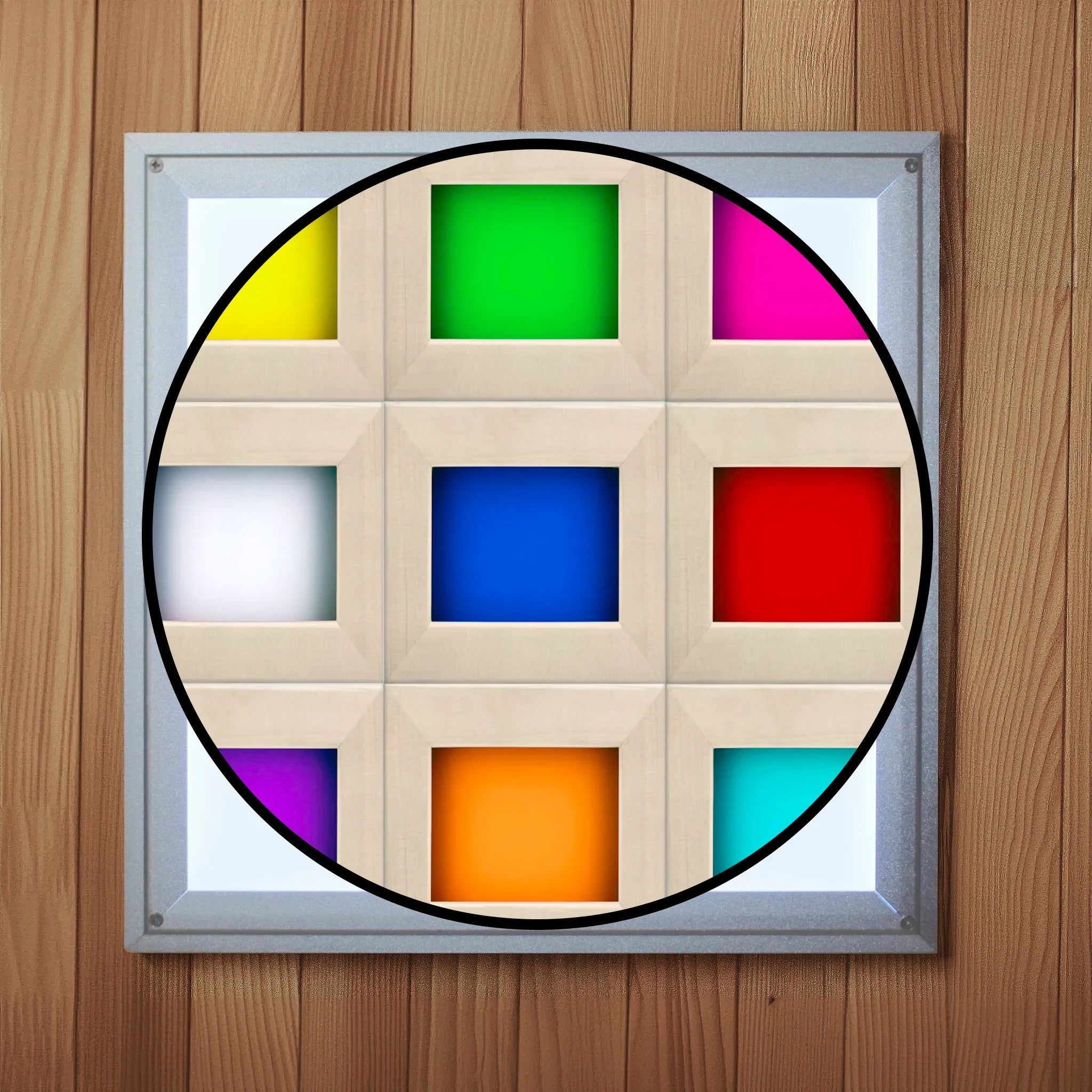 The interior white chromotherapy lighting cover inside a wooden sauna with a cutout showing the nine colors the light can display including purple, orange, aqua, red, dark blue, white, magenta, green, and yellow