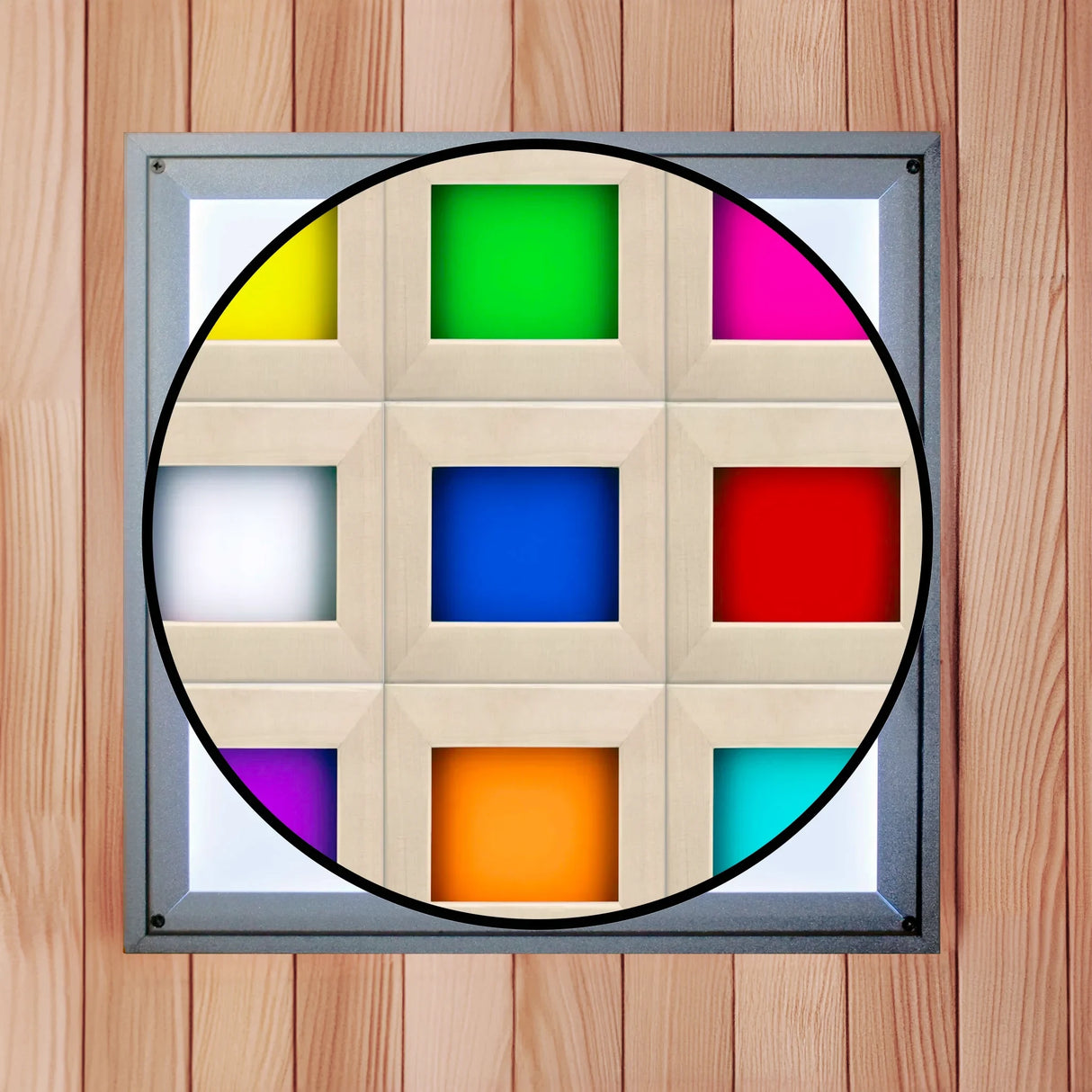 White overhead chromotherapy light found inside of a sauna with a cutout illustrating the 9 colors the light can generate. The colors include yellow, green, magenta, white, royal blue, red, aqua, orange, and purple