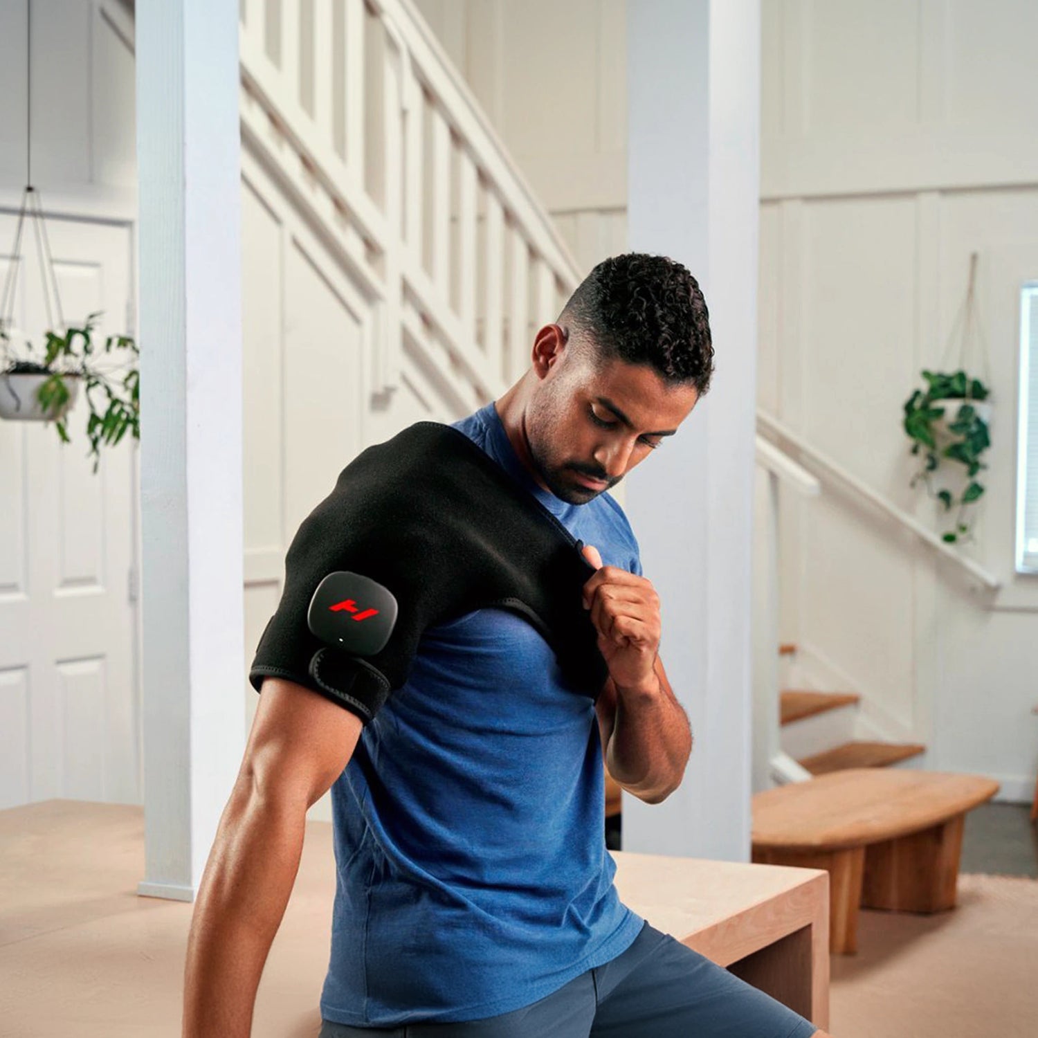Pad which wraps around your shoulder to provide heat and vibration therapy to increase circulation and decrease pain