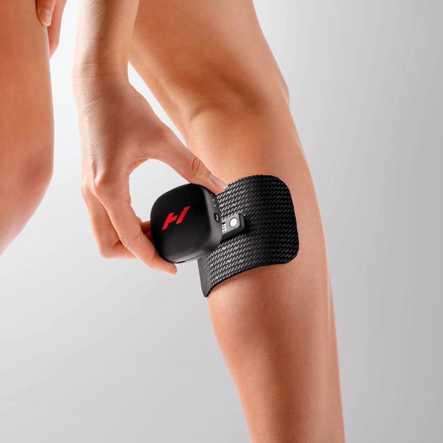 Heat and vibration therapy device which magnetizes to a pad which you stick to your body to help alleviate muscle soreness and speed up recovery