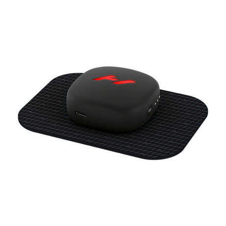 Heat and vibration therapy device which magnetizes to a pad which you stick to your body to help alleviate muscle soreness and speed up recovery