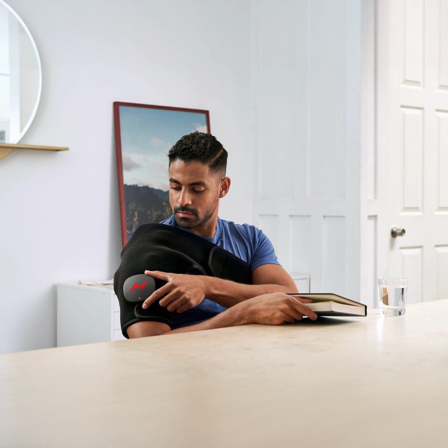 Pad which wraps around your shoulder to provide heat and vibration therapy to increase circulation and decrease pain