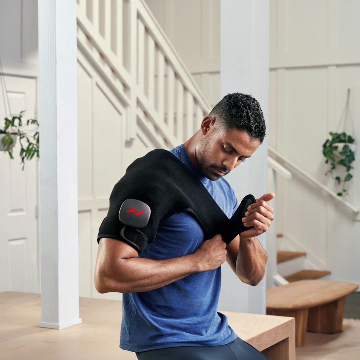 Pad which wraps around your shoulder to provide heat and vibration therapy to increase circulation and decrease pain