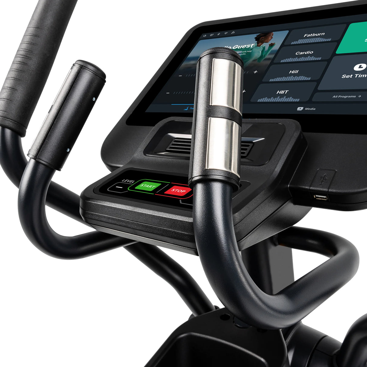 Close-up of the Spirit Fitness CE800ENT Elliptical's console and handlebars, showing a digital touchscreen with workout info, heart rate sensors on the handles, and green/red start-stop buttons below the screen.