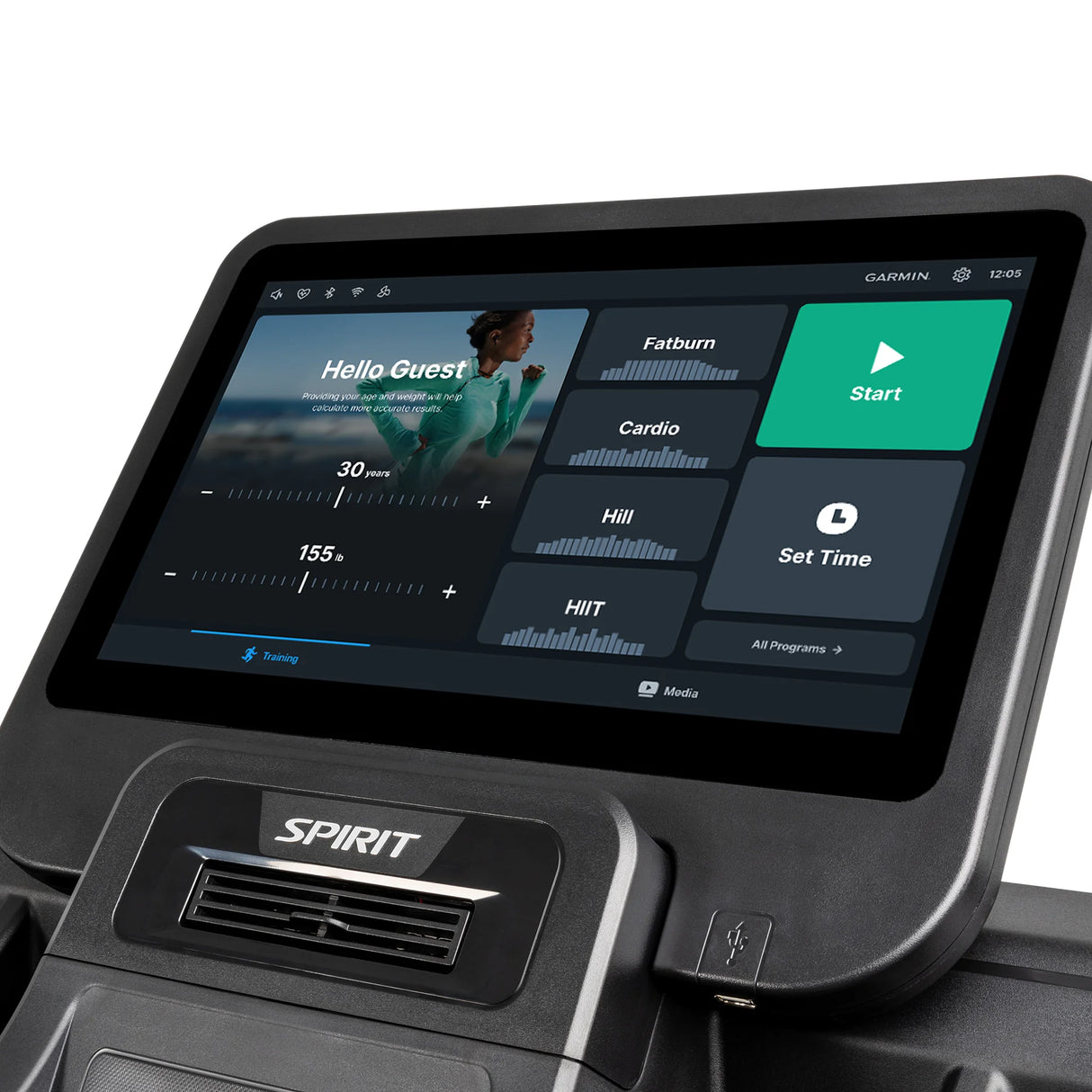 Close-up of the Spirit Fitness CT850ENT Treadmill display by Spirit Fitness, showing workout options like Fatburn, Cardio, Hill, and HIIT. The screen greets the user as Guest and includes program selection and time adjustment settings.