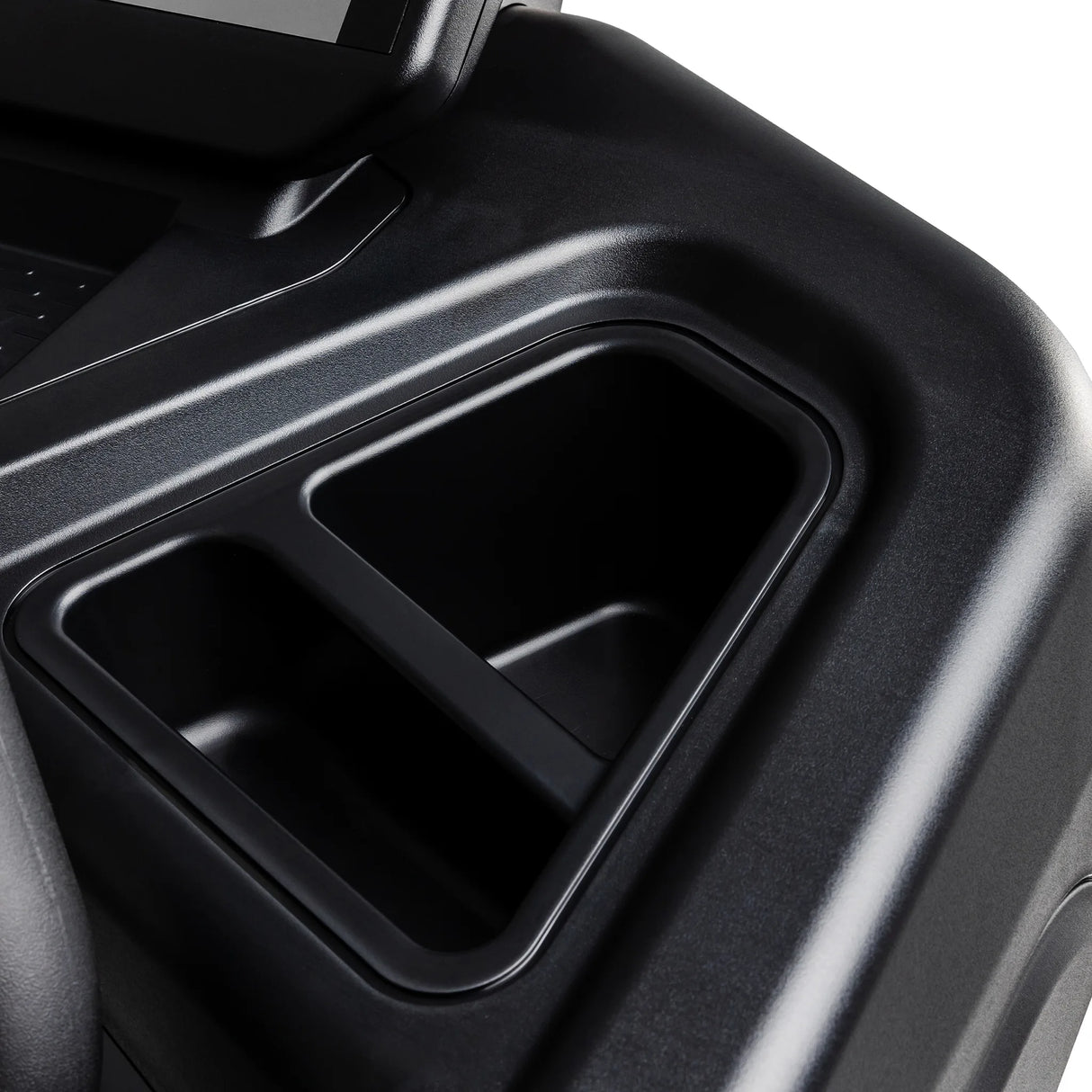 Close-up of a black plastic dual cup holder integrated into the console of the Spirit Fitness CT900 Treadmill by Spirit Fitness, shown against a white background.
