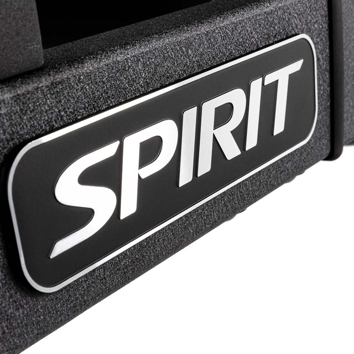 Macro close-up of the SPIRIT logo badge on the Spirit Fitness CTSBS900 handrail.