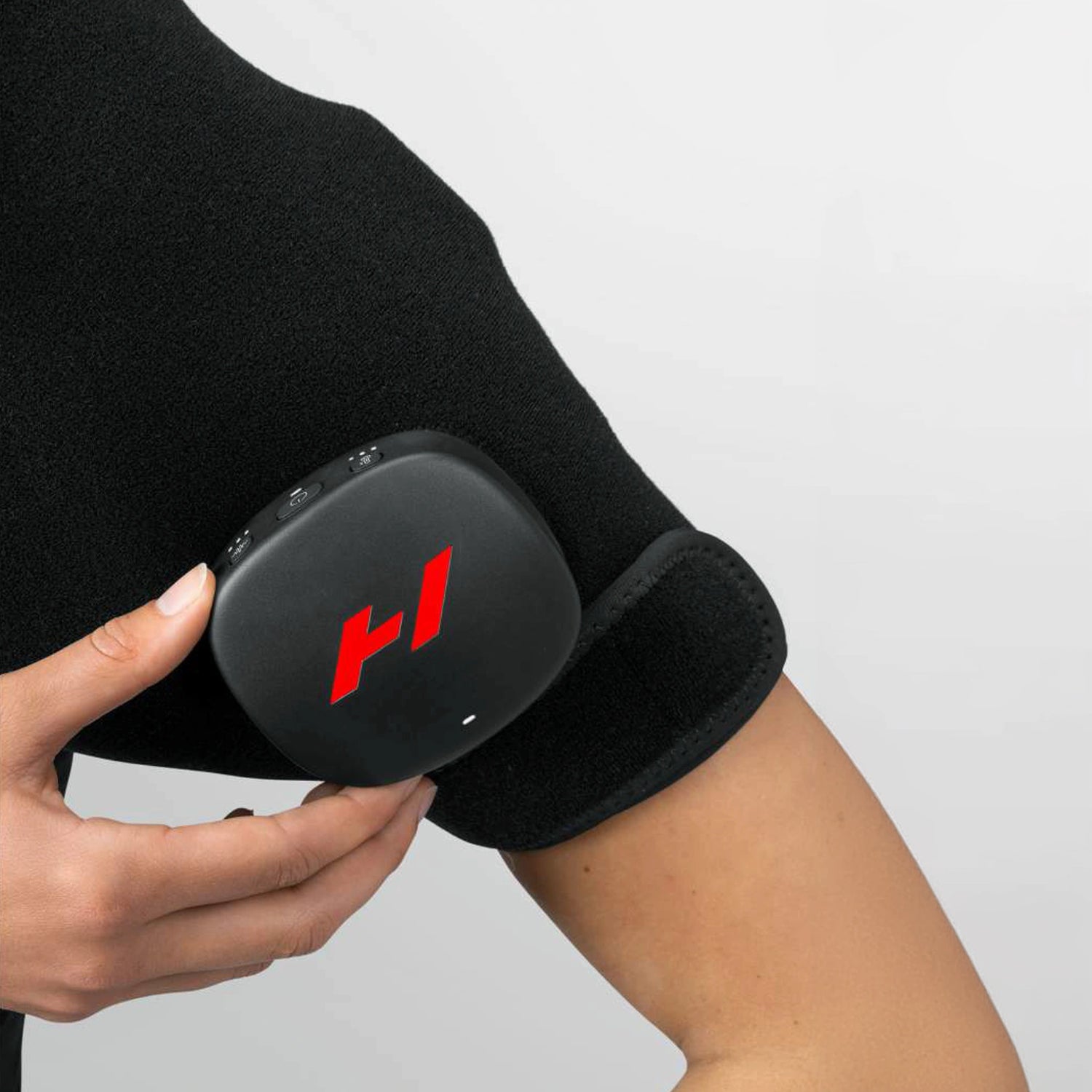 Pad which wraps around your shoulder to provide heat and vibration therapy to increase circulation and decrease pain