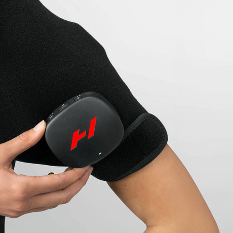 Pad which wraps around your shoulder to provide heat and vibration therapy to increase circulation and decrease pain