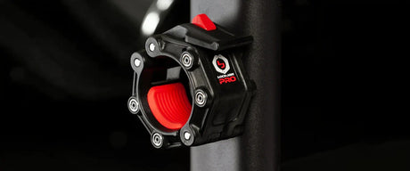 A black and red barbell collar magnetized to a metal beam