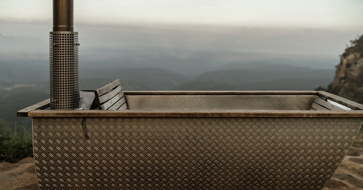 a large metal tub sitting on top of a mountain
