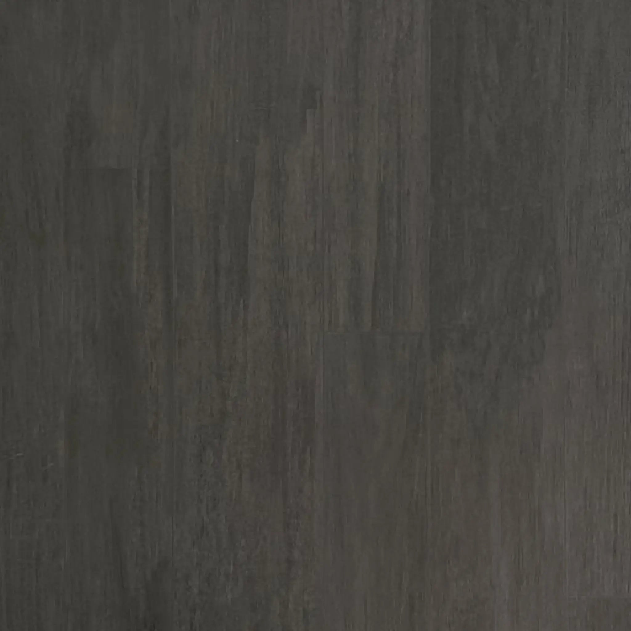 ECORE Athletic’s Balanced Motivate Laminate Roll - 7mm Class 1 Flooring features a dark gray, matte surface with subtle streaks and wood or stone-like texture, offering a natural, uniform look ideal for backgrounds or flooring.