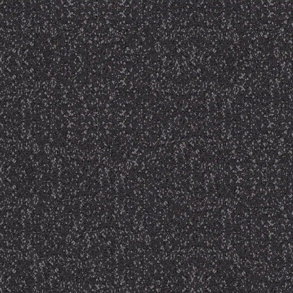 Close-up of ECORE Performance Beast Rubber Roll - 10.5mm Flooring by ECORE Athletic shows a dark, textured surface with small, irregularly shaped stones for a rough, speckled gray and black pattern.