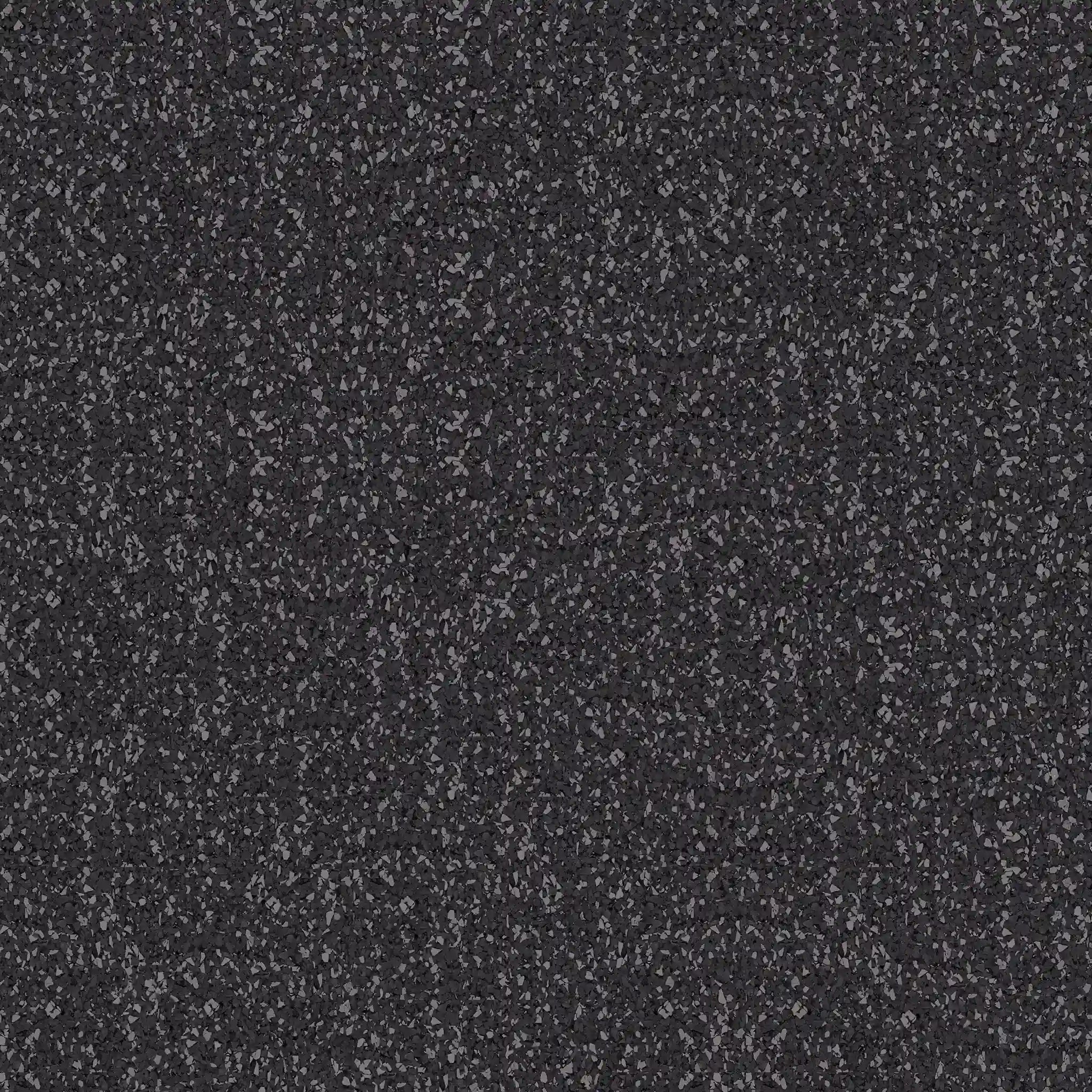 Close-up of ECORE Performance Motivate Plus Rubber Roll - 10.5mm Flooring by ECORE Athletic, featuring a dark, textured surface with small, unevenly scattered stones in shades from dark gray to black for a gritty, coarse appearance.