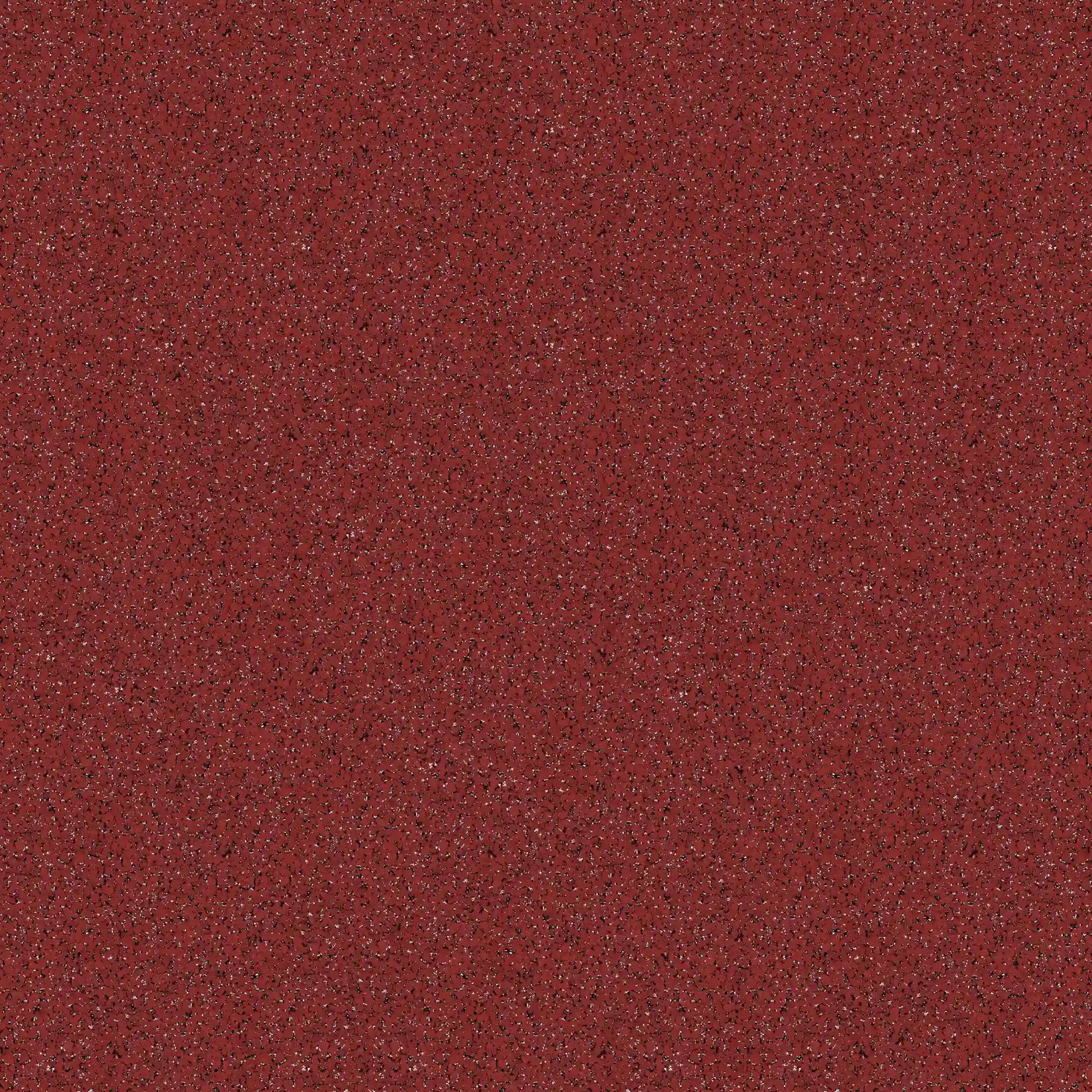 A close-up of ECORE Performance Motivate Plus Rubber Roll - 10.5mm Flooring by ECORE Athletic shows its textured red surface with small dark and light speckles scattered throughout.