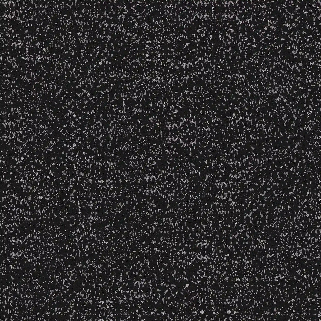 A close-up of the ECORE Performance Beast Rubber Roll - 10.5mm Flooring by ECORE Athletic, featuring a black surface with small white speckles that resemble a starry night sky or speckled granite countertop.