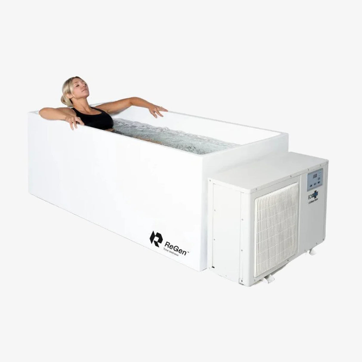 A rectangular cold plunge filled with water with a white exterior and a white external chiller unit on the right side of the plunge. In the plunge is a blonde woman lying down with her eyes closed.