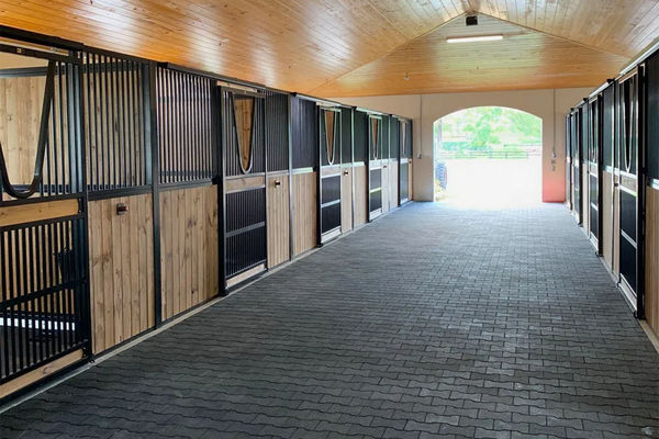 A modern alley with a black rubber paver floor