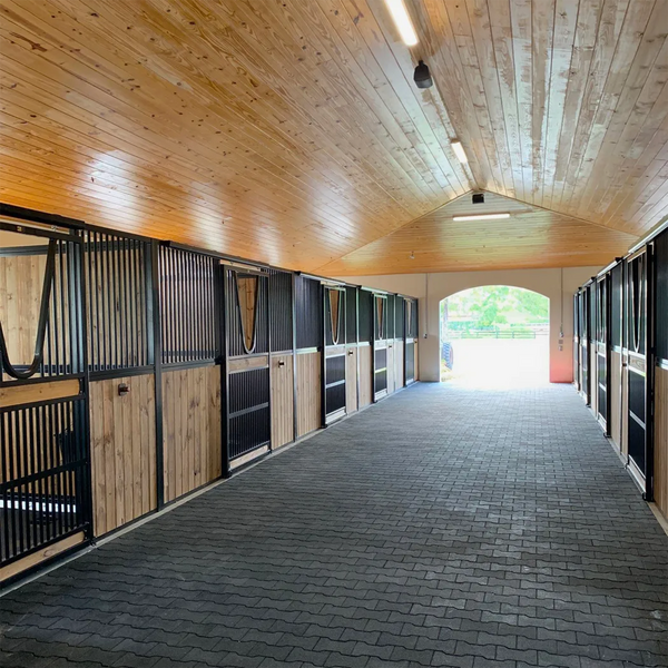 A modern alley with a black rubber paver floor