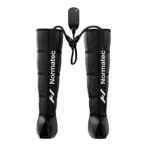 A pair of Normatec 3 Legs compression devices by Hyperice, featuring inflatable zones for leg massaging, with a control unit attached air tubes.