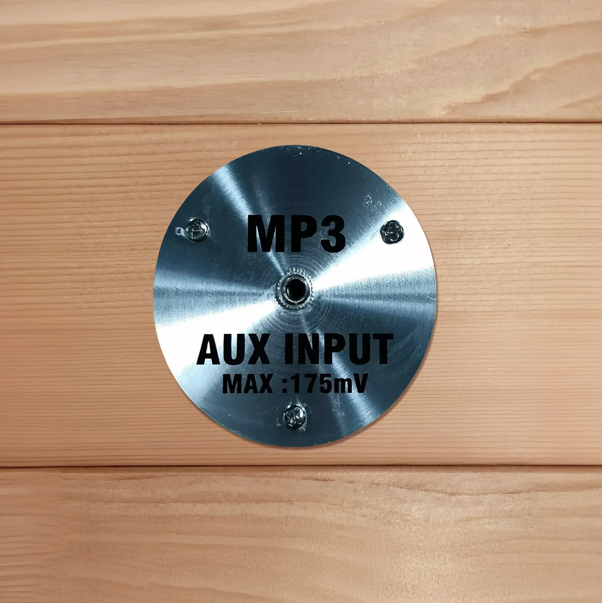 Auxiliary input port for an AUX cord found inside of a sauna