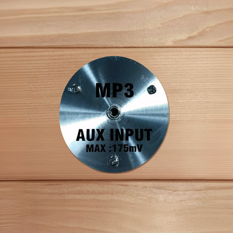 Auxiliary input port for an AUX cord found inside of a sauna