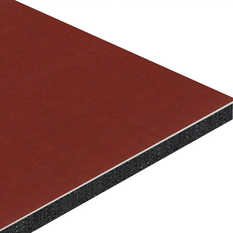 A close-up of the ECORE Baller Rally Laminate Roll - 14mm Class 2 Flooring by ECORE Athletic displays its layered construction: a red top surface, thin white middle layer, and thick black core shown at an angle.