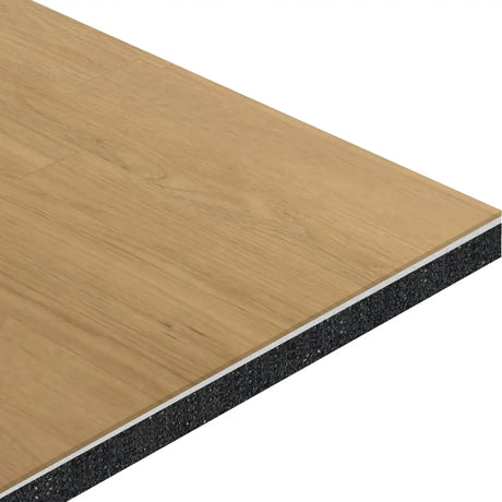 A close-up of the ECORE Athletic ECORE Baller Rally Laminate Roll - 14mm Class 2 Flooring highlights its light woodgrain surface, thin white core, and thick black base layers, displayed at an angle.