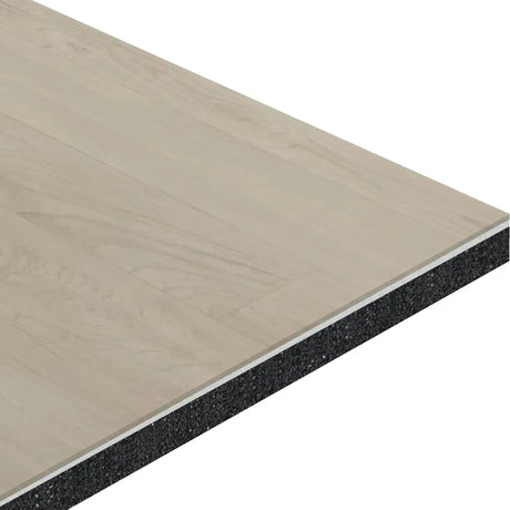 A close-up of the ECORE Baller Rally Laminate Roll - 14mm Class 2 Flooring by ECORE Athletic highlights its light wood-patterned surface and thick black underlayer, showcasing the flooring’s layered construction and materials.