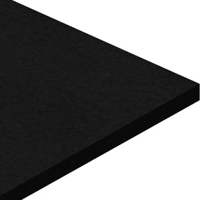 A close-up of the corner of an ECORE Basic Fit Rubber Roll - 6mm Flooring by ECORE Athletic, featuring a smooth, rectangular slab with a polished black surface against a white background.
