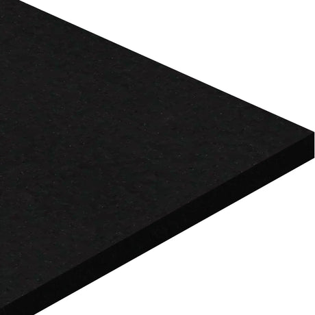 A close-up of the corner of an ECORE Basic Fit Rubber Roll - 6mm Flooring by ECORE Athletic, featuring a smooth, rectangular slab with a polished black surface against a white background.