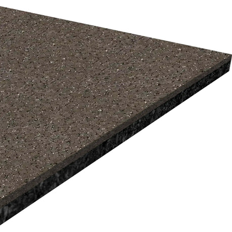 A close-up view of a rectangular piece of ECORE Performance Beast Rubber Roll - 10.5mm Flooring by ECORE Athletic, featuring a dark, speckled surface with a polished finish and beveled edge.