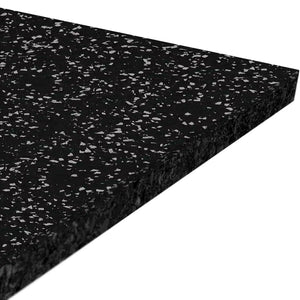 A close-up of the ECORE Performance Motivate Plus Rubber Roll - 10.5mm Flooring by ECORE Athletic, a thick rectangular black mat with small white speckles, shown at an angle against a white background.