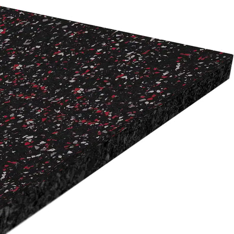 A close-up angled view of the ECORE Athletic Performance Beast Plus Rubber Roll - 14.5mm Flooring, a thick rectangular black mat with red and gray speckles, is shown against a white background.