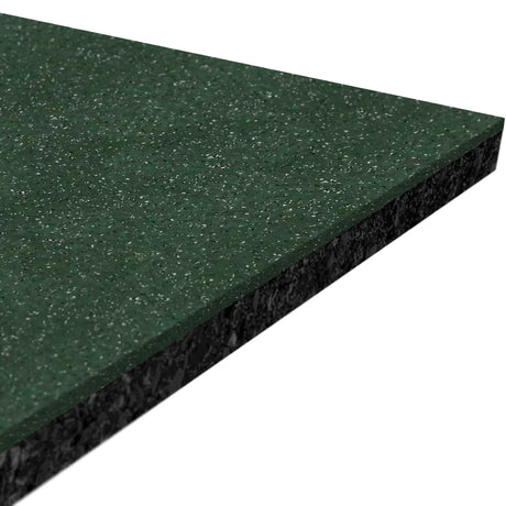 A close-up of the corner of ECORE Performance Beast Plus Rubber Roll - 14.5mm Flooring by ECORE Athletic shows its dark green, speckled surface with a textured edge and glossy finish.