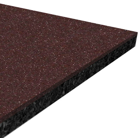 A close-up of a triangular piece of ECORE Performance Beast Plus Rubber Roll - 14.5mm Flooring by ECORE Athletic, showing its maroon speckled surface texture and dark edge.
