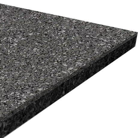 A close-up of the ECORE Performance Beast Plus Rubber Roll - 14.5mm Flooring by ECORE Athletic, featuring a rectangular, speckled black mat with visible thickness and textured surface shown from an angle.