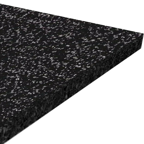 A close-up of the ECORE Athletic Performance Motivate Plus Rubber Roll - 10.5mm Flooring shows its thick black surface with white and gray speckles, viewed at an angle against a white background.