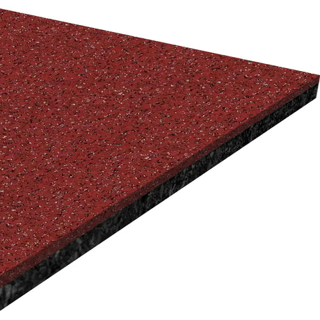 A close-up view of the ECORE Athletic Performance Beast Rubber Roll - 10.5mm Flooring shows its square, speckled red and black textured surface with a layered edge highlighting the thickness of the material.