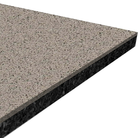 Close-up of ECORE Performance Motivate Plus Rubber Roll - 10.5mm Flooring by ECORE Athletic, showing a rectangular piece with a speckled grey surface, black and light flecks, flat top, and rough-edged side.