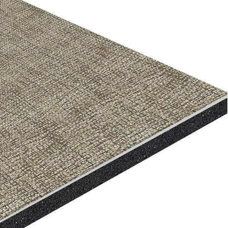 An angled close-up of the ECORE Athletic Ebb & Flow Motivate Laminate Roll - 6mm Class 1 Flooring shows its rectangular beige tile with a textured, woven fabric-like surface and black underlayer.