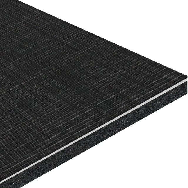 A close-up of the ECORE Ebb & Flow Motivate Laminate Roll - 6mm Class 1 Flooring by ECORE Athletic shows its dark, rectangular board with a textured grid surface and visible layered core at the edge.