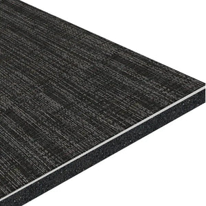 A close-up of the ECORE Ebb & Flow Motivate Laminate Roll - 6mm Class 1 Flooring from ECORE Athletic shows its black, rectangular, textured panel with a woven surface pattern and layered construction at the edges.