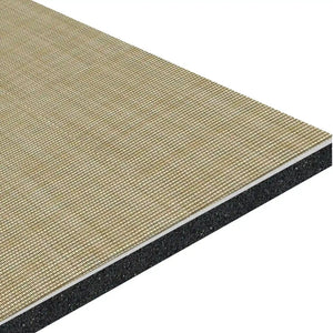 An angled close-up of ECORE Ebb & Flow Motivate Laminate Roll - 6mm Class 1 Flooring by ECORE Athletic reveals a beige textured top layer, solid black foam core, and thin white middle layer in its multi-layered construction.