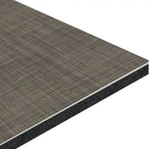 A close-up of the ECORE Ebb & Flow Motivate Laminate Roll - 6mm Class 1 Flooring by ECORE Athletic highlights its textured, grid-patterned brown surface over a dense underlayer, revealing the panel's layered construction.