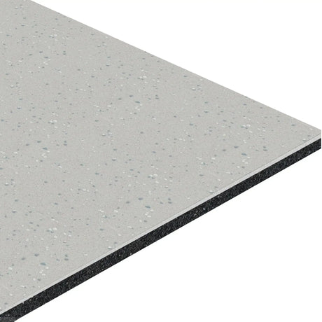 A detailed view of the ECORE Athletic HydroGrip Motivate Laminate Roll - 7mm Class 1 Flooring shows its grey textured surface with white and blue specks, highlighting its layered rectangular structure on the edge.