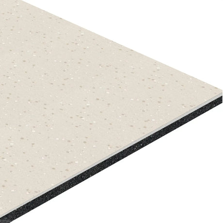 A close-up of the ECORE HydroGrip Motivate Laminate Roll - 7mm Class 1 Flooring by ECORE Athletic shows its rectangular, layered beige design with white and gray speckles on top and a visible black underlayer at the edge.