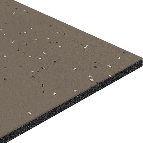 A close-up of ECORE Athletic’s Integrity Motivate Laminate Roll - 7mm Class 1 Flooring reveals its speckled brown textured surface with light and dark flecks and showcases the flooring’s layered structure.