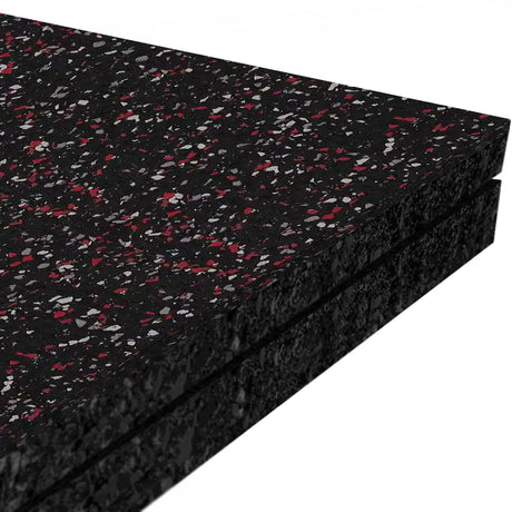 Three stacked ECORE Athletic Performance Monster Rubber Roll - 22.5mm Flooring mats with black color and red/gray speckles, shown close-up against a white background.