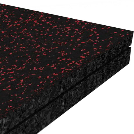 Three stacked ECORE Performance Monster Rubber Roll - 22.5mm mats by ECORE Athletic, featuring black rubber with red speckles, are shown from the side against a white background.